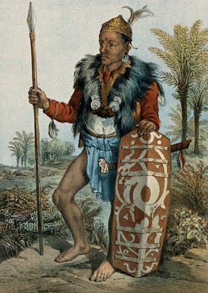 view Borneo: a Dayak warrior, standing holding a spear and a shield. Coloured lithograph by C.F. Kell after Carl Bock.