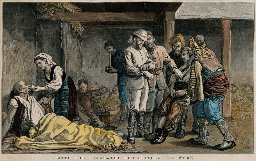 Russo-Turkish War: a wounded Turkish soldiers is brought to two doctors wearing the Red Crescent; a  nurse is giving some water to another wounded man; a makeshift hospital in the background. Coloured wood engraving by C. Roberts after J.E. Hodgson, ca. 1877.