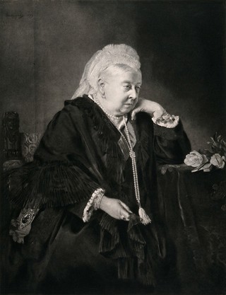 Queen Victoria at the age of eighty, seated in an armchair, her elbow resting on a table. Photogravure after H. Von Angeli, 1899.