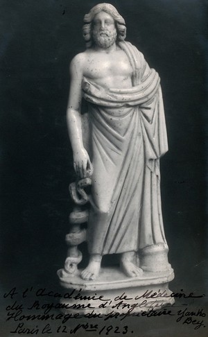 view Aesculapius: the Greek god of healing. Photograph, ca. 1923, of a white marble sculpture.