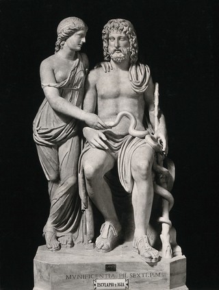 Aesculapius and Hygieia: the Greek god of healing with his daughter the Greek goddess of health. Photograph by Alinari, 1900/1920 (?), of a sculpture.