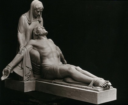 Pieta: Jesus Christ with outstretched legs supported by the Virgin Mary. Photograph, ca. 1934, of a sculpture by Helen V. Mackay, 1932.