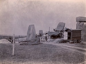 view Stonehenge, England: straightening a leaning stone: pulleys, ropes and a wooden frame attached to the stone. Photograph, 1901.