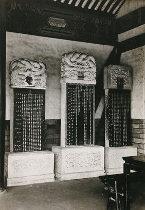 Peking tablets: three inscribed stone tablets, 8 feet high, erected by Chinese emperors including Emperor Chien Lung: housed at the College of Imperial Physicians, Beijing. Photograph, 1920/1940 (?).