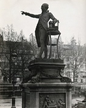 Antoine Lavoisier: statue; Lavoisier in his laboratory: bas-relief at base of plinth: Place de la Madeleine, Paris. Photograph by Giraudon, ca. 1930, of a bronze sculpture and bas-relief by Ernest-Louis Barrias, ca. 1880.