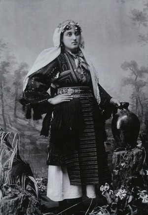 view A Bulgarian woman in national dress with a water jug.