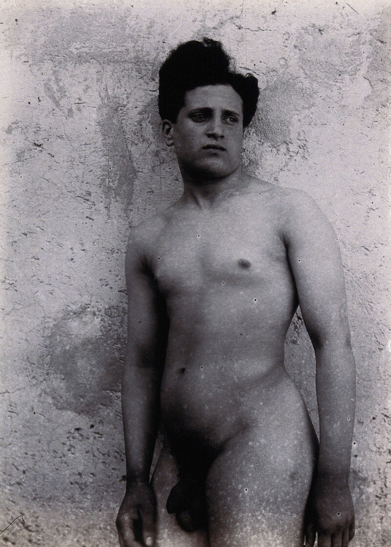 A naked Sicilian male, standing outdoors against a wall., [approximately 1900], by Vincenzo Galdi