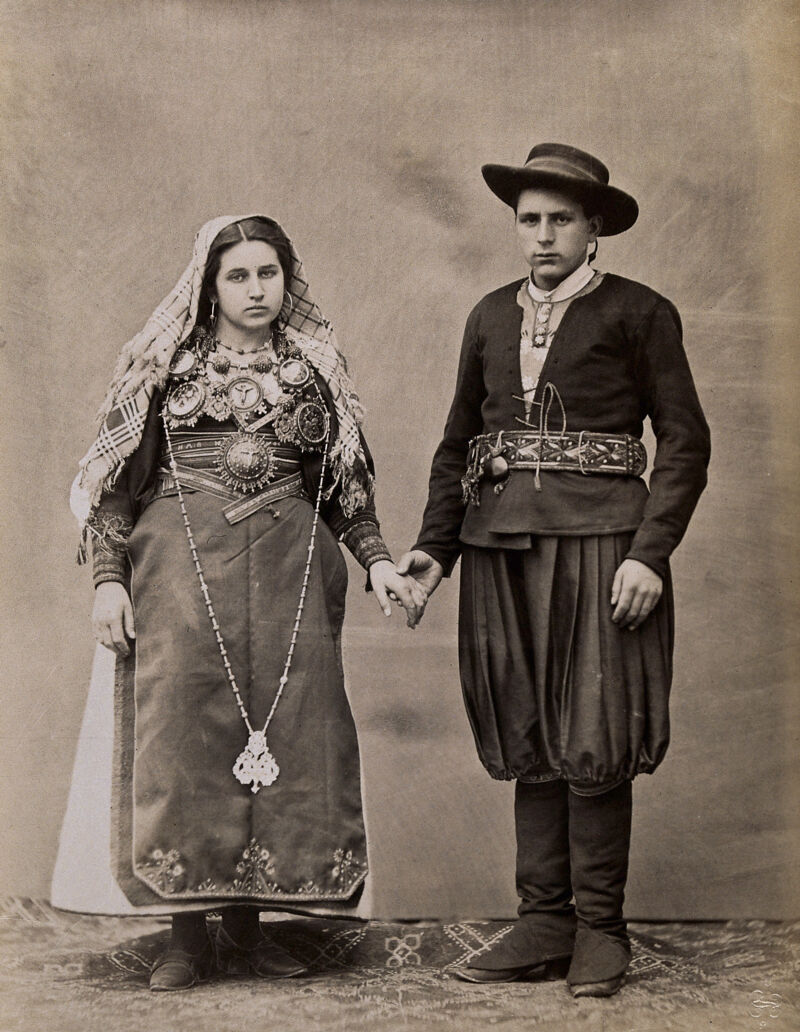 People of Leon, a man and woman holding hands, wearing traditional dress., [approximately 1880], by Jean Laurent