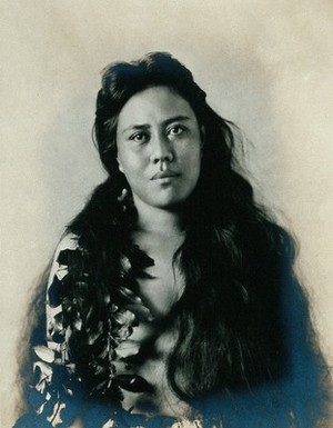 view A Samoan woman with leaves in her hair.