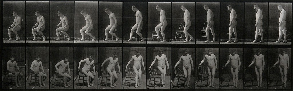 A man rising from a chair. Photogravure after Eadweard Muybridge, 1887.