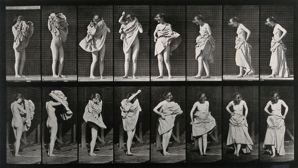 A woman putting a dress on. Collotype after Eadweard Muybridge, 1887.