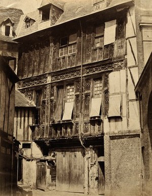 view A timber-framed house with exterior carved wooden panels, France (?). Photograph by the Bisson Frères, ca. 1860.
