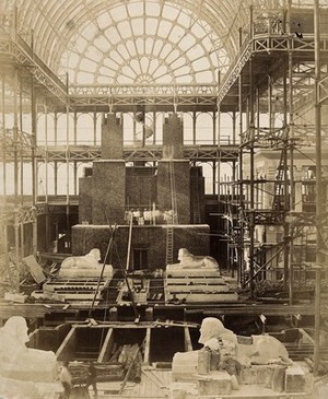 view The Crystal Palace during its re-erection at Sydenham, London: sphinxes in the unfinished interior. Photograph by Philip Delamotte, ca. 1854.