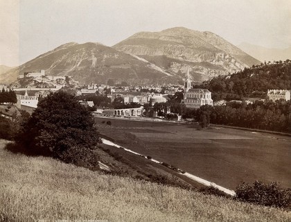 Lourdes, France: the town, cathedral and distant mountains. Photograph (by E. C. Mayes?), ca. 1893.