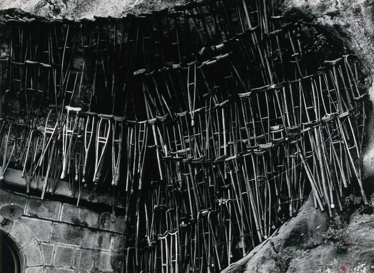 Lourdes, France the grotto of Our Lady of Lourdes crutches left