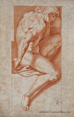 A seated nude male figure seen from the right. Red chalk drawing.