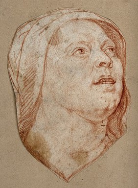 Head of a woman looking up. Red chalk drawing.