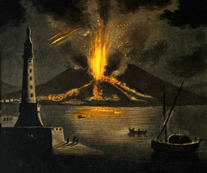 view The eruption of a volcano by the sea (Vesuvius?); lighthouse and boats in the foreground. Coloured mezzotint.