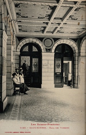 view Les Eaux-Bonnes, France: nurses in the entrance hall of a thermal establishment. Photographic postcard, ca. 1920.