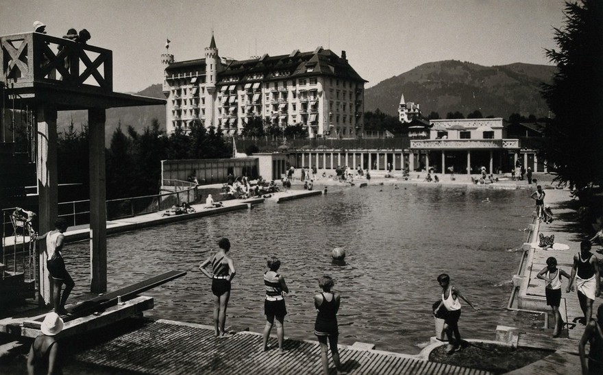 An outdoor swimming pool in Gstaad, Switzerland. Photographic postcard, ca. 1950.