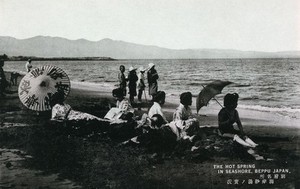 view Beppu, Japan: women sitting on the shore. Photographic postcard, ca. 1930.