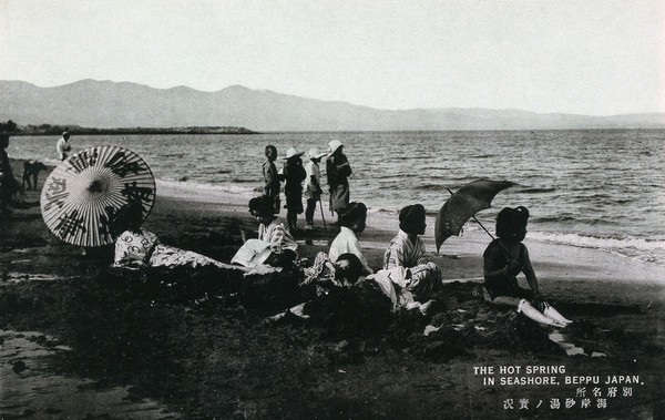 Beppu, Japan: women sitting on the shore. Photographic postcard, ca. 1930.