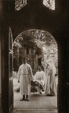 Beaunes, France: the arrival of a wounded at the Hôtel Dieu. Photographic postcard, ca. 1930.