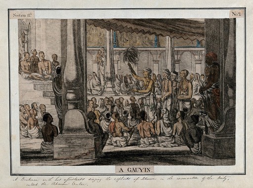 Hindu priest, or brahmin, and assistants, singing to a seated audience, Calcutta, West Bengal. Coloured etching by Francois Balthazar Solvyns, 1799.