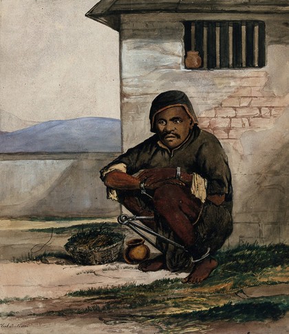 A man of Simla, squatting in a prison with manacles around his ankles. Watercolour by R. Clint, 1866.