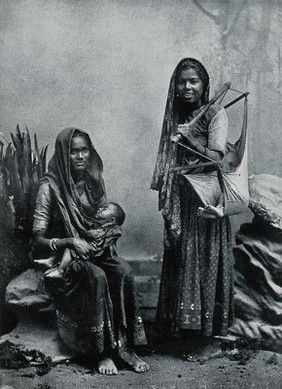 Ahmedabad women holding their babies. Process print after Bourne and Shepherd.