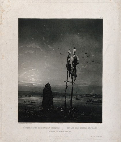 A man from the Mandan tribe is looking up at two idols placed on wooden sticks; a village in the background. Aquatint by S. Himely after Ch. Bodmer, ca. 1843.