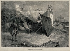 view Men at a funeral pyre in Calcutta. Wood engraving, ca. 1860.