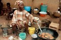 view Woman cooking food, Nigeria