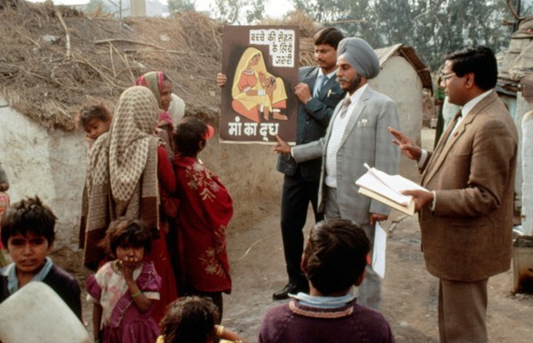 Using a poster to promote breast feeding, India