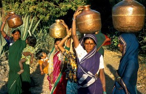 view Women carrying water pots
