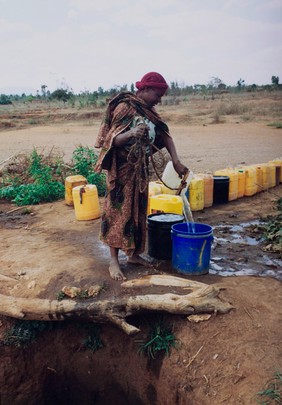 Drawing water from a well, Tanzania