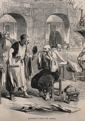 A barber's shop in Cairo; a barber holds a mirror for a man while he adjusts his moustache. Wood engraving.