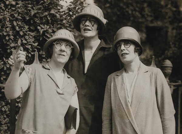 Women modelling spectacles of unusual shapes. Photograph, 1925.