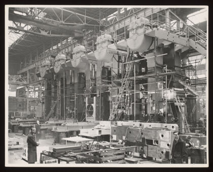 Heavy erecting shop for rolling mill engineering, Davy & United Engineering Co. Ltd., Park Iron Works, Sheffield: men are shown operating heavy machinery. Photograph, 1957.