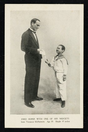 Fred Roper with one of his midgets : John Tweedlie McPherson : age 19, height 40 inches.