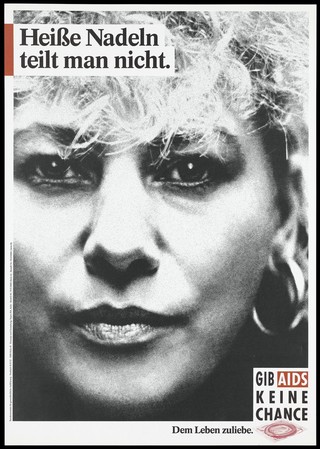 A woman with blonde hair, big earrings, pouting with painted lips; representing somebody who might be at risk of AIDS though reuse of needles. Colour lithograph, 199-.