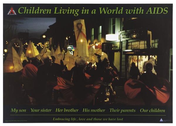 A procession of people with paper lanterns walking down a street at night; advertisment for Children Living with Aids in support of World Aids Day. Colour lithograph by North Staffordshire Health, 1996.