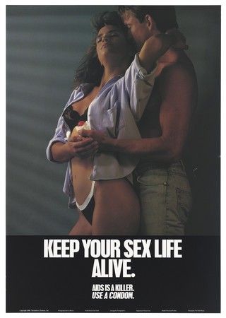 A woman in black underwear and an open shirt is embraced by a man holding a condom; advertisement for safe sex and condoms by Turtledove Clemens, Inc. Colour lithograph 1988.