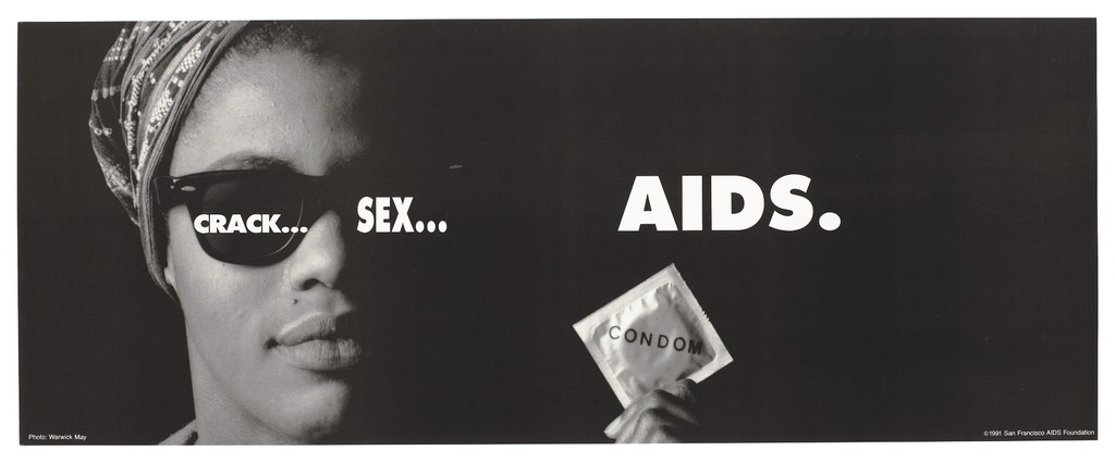 A black woman wearing glasses and a head scarf holds up a condom packet; advertisment about the dangers of drugs, sex and AIDS by the San Francisco AIDS Foundation. Lithograph by Warwick May, 1991.