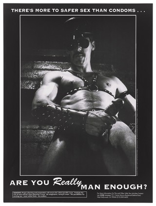 A man dressed in bondage gear, dark glasses and cap holding his penis; advertisement for safe sex to reduce the risk of HIV by the Core Program. Lithograph by Charles R. Moniz.