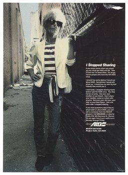 A woman drug-user in a white jacket, belted striped top and sunglasses leans against a wall in an alleyway with a message about why she stopped sharing needles; part of the Project Safe campaign by Denver AIDS Prevention. Colour lithograph by Daniel Montano, 1991.