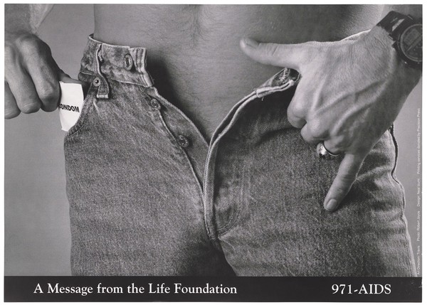 A man wearing jeans with the zip undone takes a condom out of his pocket representing an advertisement for safer sex by the Life Foundation. Lithograph by Robert Joyce and Neal Izumi.