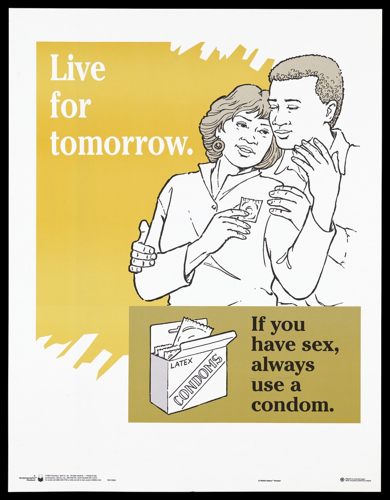 A woman holds a condom as a man holds her with a packet of latex ...
