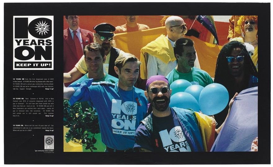 A crowd of people including men wearing t-shirts bearing the logo '10 Years On Keep It Up!', with balloons and statistics for AIDS in New Zealand in 1993; advertisement celebrating the 10th year of the New Zealand AIDS Foundation. Colour lithograph, 1993.