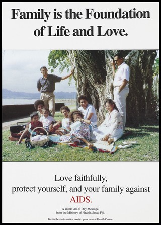 A large Fijian family having a picnic beneath a tree with a message to protect your family against AIDS; a World AIDS Day message in an advertisement by the Ministry of Health, Suva, Fiji. Colour lithograph.